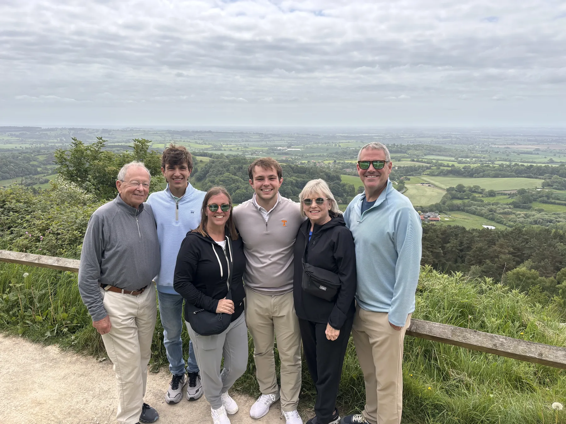 A family of all ages enjoying an easy viewpoint at Sutton Bank
